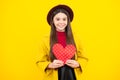 Happy teenager portrait. Young teenager child girl with heart shape. Happy Valentines Day. Love and pleasant feelings Royalty Free Stock Photo