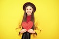 Happy teenager portrait. Young teenager child girl with heart shape. Happy Valentines Day. Love and pleasant feelings Royalty Free Stock Photo