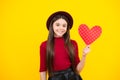 Happy teenager portrait. Young teenager child girl with heart shape. Happy Valentines Day. Love and pleasant feelings Royalty Free Stock Photo