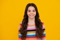 Happy teenager, positive and smiling emotions of teen girl. Children studio portrait on yellow background. Childhood Royalty Free Stock Photo