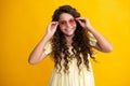 Happy teenager, positive and smiling emotions of teen girl. Tennager child girl wear sunglasses looking at camera with