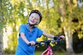 Happy teenager riding bike in the park Royalty Free Stock Photo