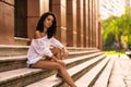 Happy teenager sitting on the stairs Royalty Free Stock Photo