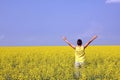 teenager in oilseed field - summer background Royalty Free Stock Photo