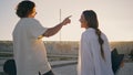 Happy teenagers dating summer town back view. Young skaters kissing together Royalty Free Stock Photo