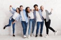 Happy teenagers having fun and posing over white wall Royalty Free Stock Photo