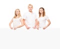 Happy teenagers holding a blank white banner Royalty Free Stock Photo