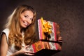 A happy teenge girl opening a Christmas present Royalty Free Stock Photo