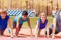 Happy teens doing push-up exercises on the track Royalty Free Stock Photo