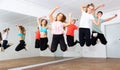 Happy teens jumping in choreography class Royalty Free Stock Photo