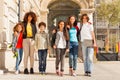 Happy teens with skateboards walking at sunny day Royalty Free Stock Photo