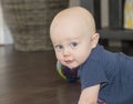 A Happy Teething Baby Boy Drools & Looks at the Camera