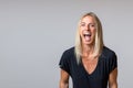 Happy temperamental woman yelling at the camera Royalty Free Stock Photo