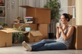 Happy tenant resting drinking coffee moving home Royalty Free Stock Photo