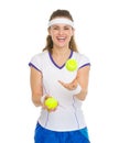 Happy tennis player joggling with tennis balls Royalty Free Stock Photo