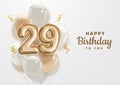 Happy 29th birthday gold foil balloon greeting background. Royalty Free Stock Photo