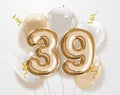 Happy 39th birthday gold foil balloon greeting background. Royalty Free Stock Photo