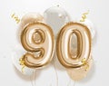 Happy 90th birthday gold foil balloon greeting background.