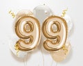 Happy 99th birthday gold foil balloon greeting background.