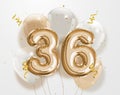 Happy 36th birthday gold foil balloon greeting background.