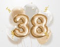 Happy 38th birthday gold foil balloon greeting background. Royalty Free Stock Photo