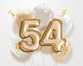 Happy 54th birthday gold foil balloon greeting background. Royalty Free Stock Photo