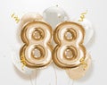 Happy 88th birthday gold foil balloon greeting background. Royalty Free Stock Photo