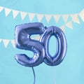 Happy 50th birthday party celebration blue balloon and bunting. 3D Render Royalty Free Stock Photo