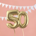 Happy 50th birthday party celebration gold balloon and bunting. 3D Render Royalty Free Stock Photo