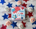 Happy 4th of July cake with cupcakes seen from above Royalty Free Stock Photo