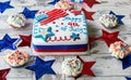 Happy 4th of July cake surrounded by cupcakes Royalty Free Stock Photo