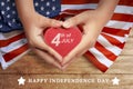 Happy 4th of July sign on heart at people hand Royalty Free Stock Photo