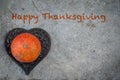 Happy thanksgiving ,pumpkin on heart ,stone background