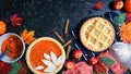 Thanksgiving apple and pumpkin pies on dark marble background.