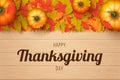 Happy thanksgiving day background with autumn leaves, pumpkins and wooden background. Royalty Free Stock Photo