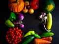 Happy Thanksgiving Day background, black wooden table decorated with pumpkins and autumn vegetables. Harvest festival. Colorful Royalty Free Stock Photo