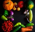 Happy Thanksgiving Day background, black wooden table decorated with pumpkins and autumn vegetables. Harvest festival. Colorful Royalty Free Stock Photo