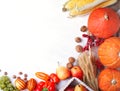 Happy Thanksgiving Day background, table decorated with Pumpkins, Maize, fruits and autumn leaves. Harvest festival. The Royalty Free Stock Photo