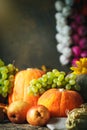 Happy Thanksgiving Day background, wooden table decorated with Pumpkins, Maize, fruits and autumn leaves. Harvest Royalty Free Stock Photo