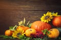 Happy Thanksgiving Day background, wooden table, decorated with vegetables, fruits and autumn leaves. Autumn background.