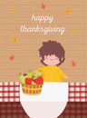 Happy thanksgiving day boy with basket filled fruits tablecloth