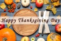 Happy Thanksgiving Day card. Flat lay composition with tableware, autumn fruits and vegetables on blue wooden table Royalty Free Stock Photo