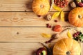 Happy Thanksgiving day concept. Autumn composition with orange pumpkins, fallen leaves, apples, red berries, walnuts, wheat on Royalty Free Stock Photo