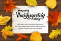 Happy Thanksgiving day lettering with falling leaves