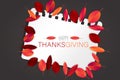 Happy Thanksgiving Day poster.  Background with red and orange fall leaves on torn out sheet of paper. American traditional novemb Royalty Free Stock Photo