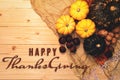 Happy Thanksgiving Day with pumpkin and nut on wooden background Royalty Free Stock Photo