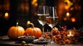 Happy Thanksgiving Day! Two glasses of white wine on a wooden table with pumpkins and candles