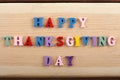 HAPPY THANKSGIVING DAY - word on wooden background composed from colorful abc alphabet block wooden letters, copy space Royalty Free Stock Photo