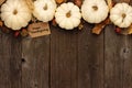 Happy Thanksgiving gift tag with top border of white pumpkins over wood