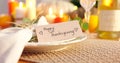 Happy thanksgiving, giftcard and table decoration for celebration dinner on holiday, care and event in apartment. Plate